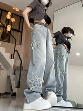 Cerulis – Schlaghose aus Denim mit Wickeldesign und Sternen